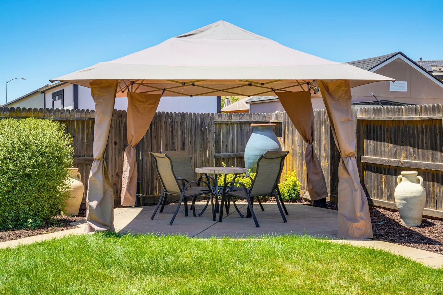 Private backyard gazebo with outdoor dining