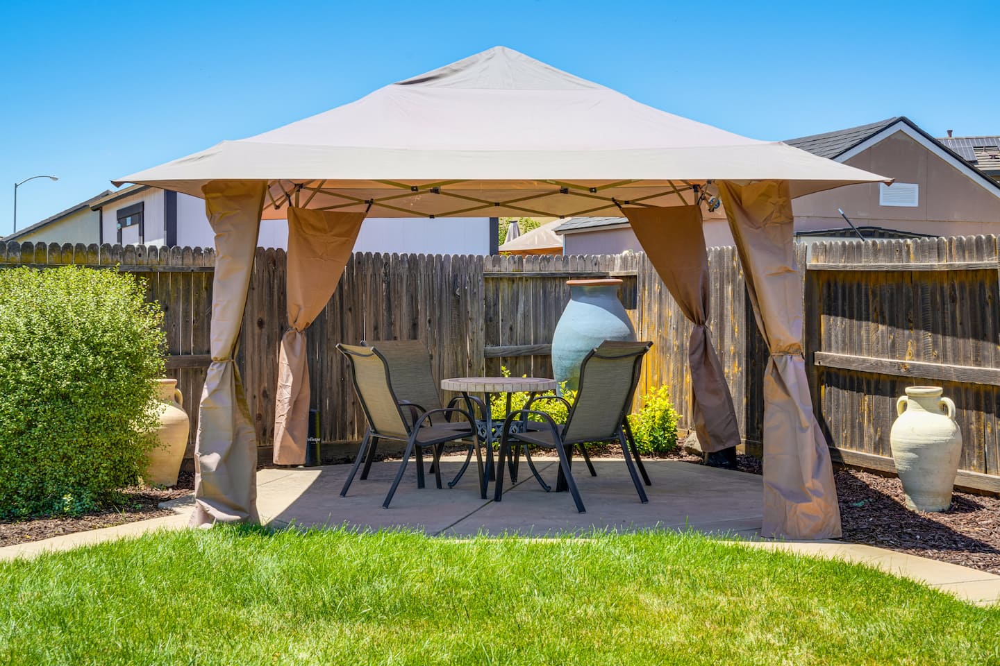 Private backyard gazebo with outdoor dining