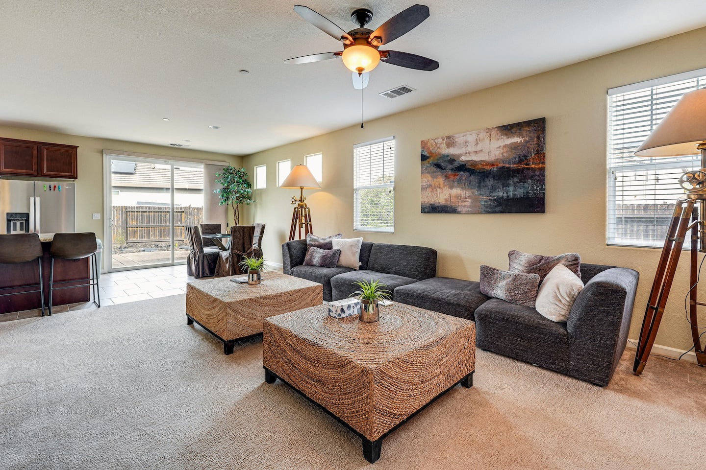 Living area with sofas and access to the backyard